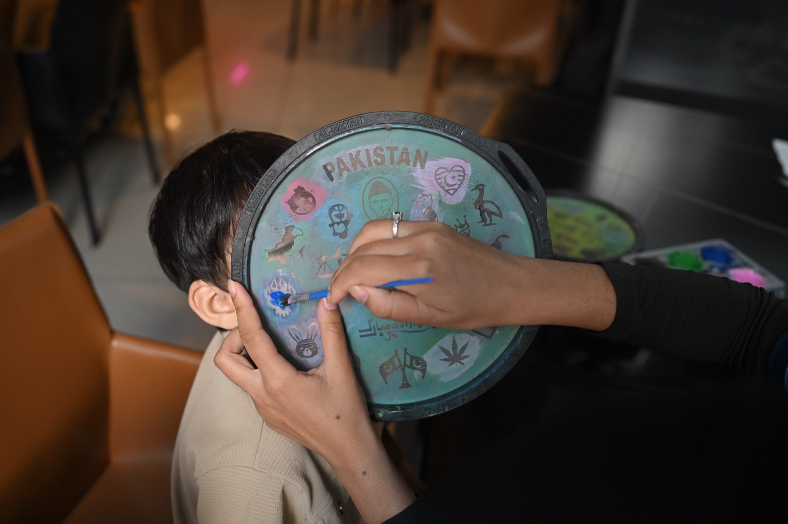 Child busy with an arts-and-crafts activity at Wonder World